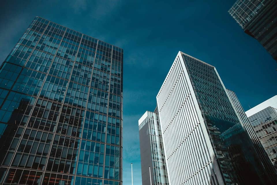 view from the ground looking up at office buildings